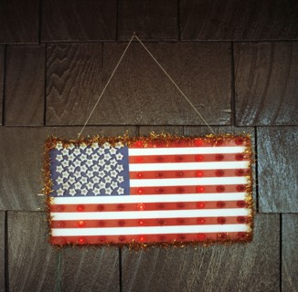 Handmade American flag hanging on wall