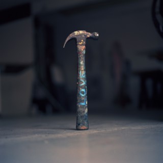 Dirty hammer with the word 'love' written on it