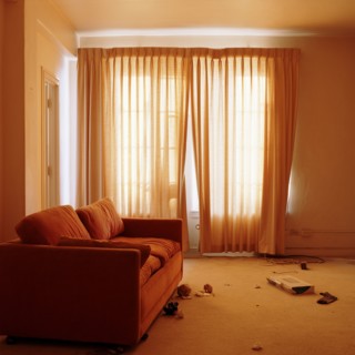 Sofa in messy living room