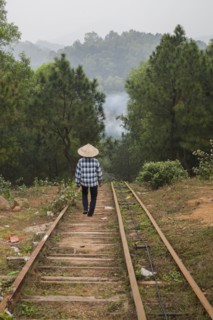 Woman walking on steps on rural hillside