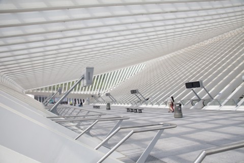 Couple walking in modern train station