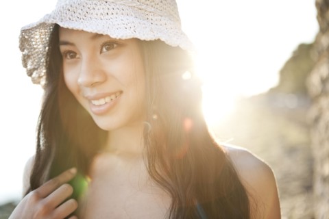 Smiling Chinese woman in hat