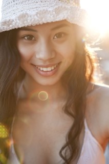 Smiling Chinese woman in hat