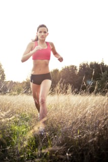 Jogger running through field