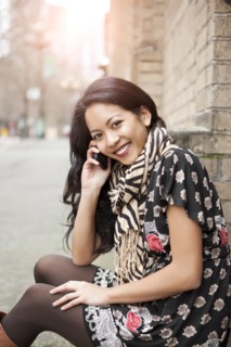 Mixed race woman talking on cell phone