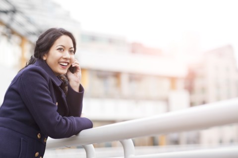 Mixed race woman talking on cell phone