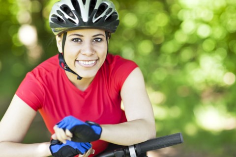 Hispanic woman riding mountain bike