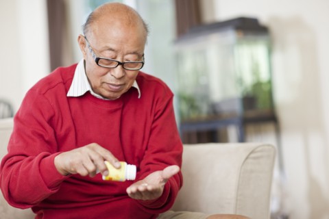 Chinese man taking medication