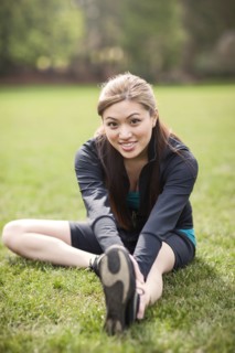 Asian woman warming up before exercise