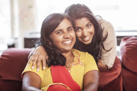 Smiling Indian mother and daughter
