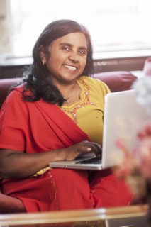 Indian woman using digital tablet