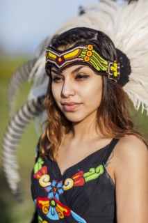 Native American woman wearing traditional headdress