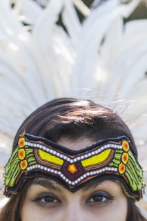 Native American woman wearing traditional headdress