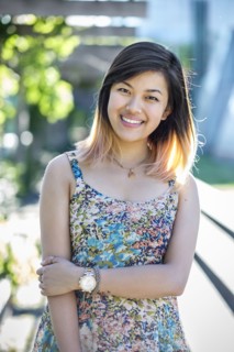 Portrait of smiling Chinese woman wearing dress