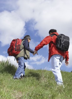 Asian father and son backpacking
