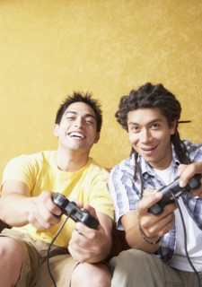 Two Hispanic men playing video games