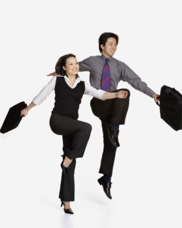 Studio shot of Asian businesspeople skipping