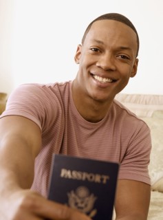 African man holding out passport