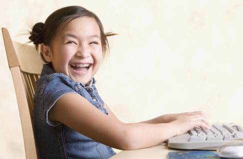 Young Asian girl using computer