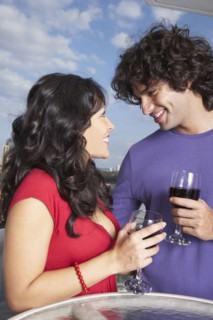 Hispanic couple smiling at each other