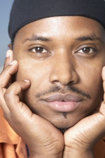 Close up of African man with chin in hands