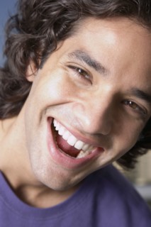 Close up of Hispanic man laughing