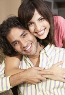 Close up of Hispanic couple hugging