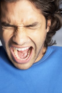 Close up of Hispanic man yelling