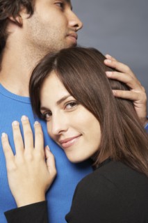 Close up of Hispanic couple hugging