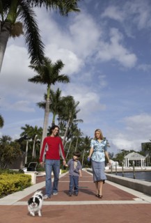 Hispanic family walking dog