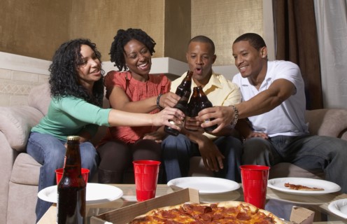 Multi-ethnic friends having pizza party