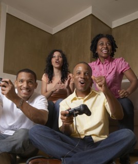 Multi-ethnic friends playing video games