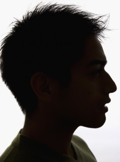 Silhouette profile of Pacific Islander man