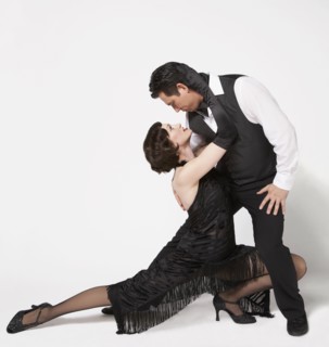 Multi-ethnic couple tango dancing