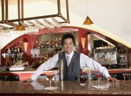 Asian male bartender and cocktails