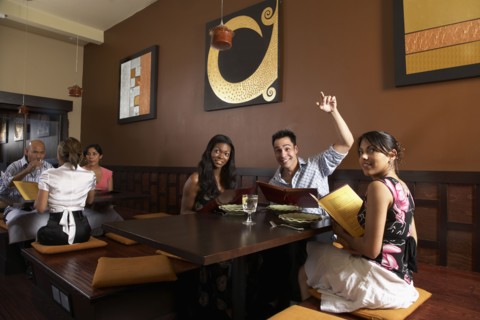 Multi-ethnic friends at restaurant
