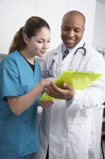 Multi-ethnic medical professionals discussing chart