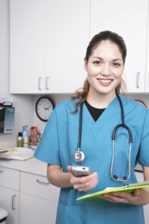 Hispanic female medical professional holding chart
