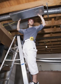 Middle Eastern man remodeling house