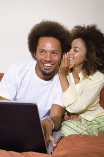 African couple telling secret
