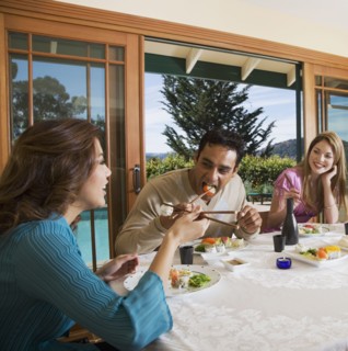 Multi-ethnic couples eating sushi
