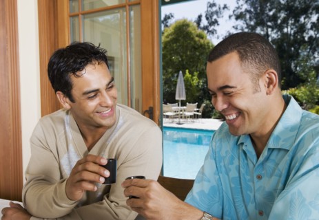 Multi-ethnic men toasting with sake
