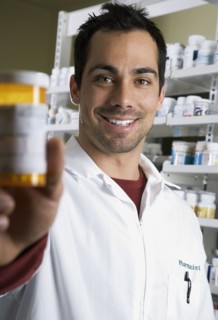 Pacific Islander pharmacist holding medication bottle