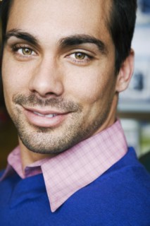 Close up of Pacific Islander man smiling
