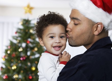 African father kissing baby