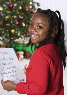 African girl holding letter for Santa Claus