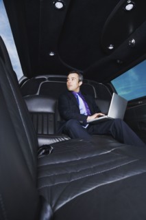 Hispanic businessman typing on laptop