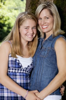 Caucasian mother and daughter holding hands