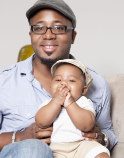 African American holding baby son in lap