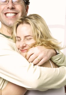 Caucasian couple hugging